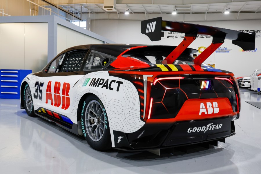 A prototype of the first electric racecar is displayed at the NASCAR R&D Center in Concord, N.C., Monday, July 1, 2024. The top motorsports series in North America partnered with Chevrolet, Ford, Toyota and electrification company ABB to demonstrate a high-performance electric vehicle and gauge fan interest in electric racing. (AP Photo/Nell Redmond)