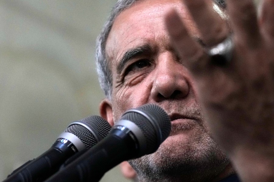 Iran's President-elect Masoud Pezeshkian speaks in a meeting a day after the presidential election, at the shrine of the late revolutionary founder Ayatollah Khomeini, just outside Tehran, Iran, Saturday, July 6, 2024. (AP Photo/Vahid Salemi)