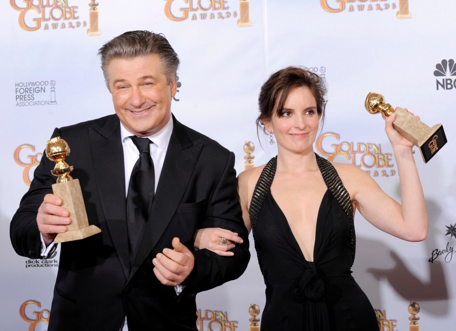 FILE - Alec Baldwin, left, winner of the best actor in a television series, comedy or musical for "30 Rock", and fellow cast member Tina Fey, winner of best actress in a television series, comedy or musical pose backstage with their awards at the 66th Annual Golden Globe Awards on Sunday, Jan. 11, 2009, in Beverly Hills, Calif. (AP Photo/Mark J. Terrill, File)