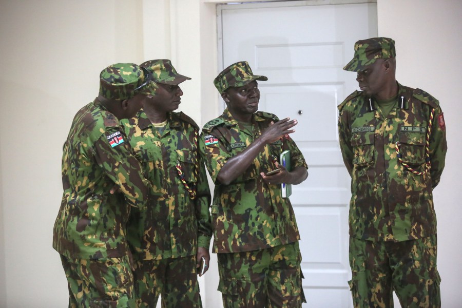 Members of a UN-backed Kenyan police stand at the police headquarters ahead of a press conference in Port-au-Prince, Haiti, Monday, July 8, 2024. (AP Photo/Odelyn Joseph)