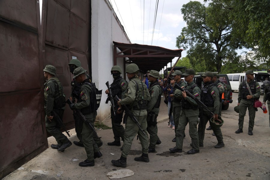 FILE - Soldiers raid the Tocorón Penitentiary Center, in Tocorón, Venezuela, Wednesday, Sept. 20, 2023. The Tren de Aragua gang originated at the prison. The Biden administration on Thursday, July 11, 2024, sanctioned the Venezuelan gang allegedly behind a spree of kidnappings, extortion and other violent crimes tied to migrants that have spread across Latin America and the United States. (AP Photo/Ariana Cubillos, File)