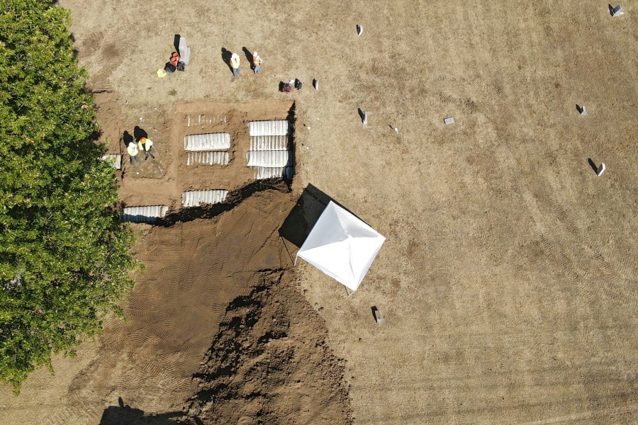 FILE - Crews work at Oaklawn Cemetery during an excavation while searching for bodies from the 1921 Tulsa Race Massacre, Oct. 27, 2022, in Tulsa, Okla. Tulsa Mayor G.T. Bynum and officials with Intermountain Forensics said Friday, July 12, 2024, that remains exhumed from the cemetery in the search for victim of the 1921 Tulsa Race Massacre have been identified. (Mike Simons/Tulsa World via AP, File)