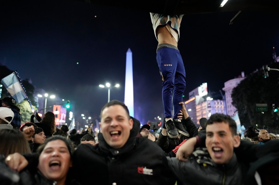 Fans of Argentina celebrate at the Obelisk after their team defeated Colombia at the Copa America final soccer match in Buenos Aires, Argentina, Monday, July 15, 2024. (AP Photo/Rodrigo Abd)