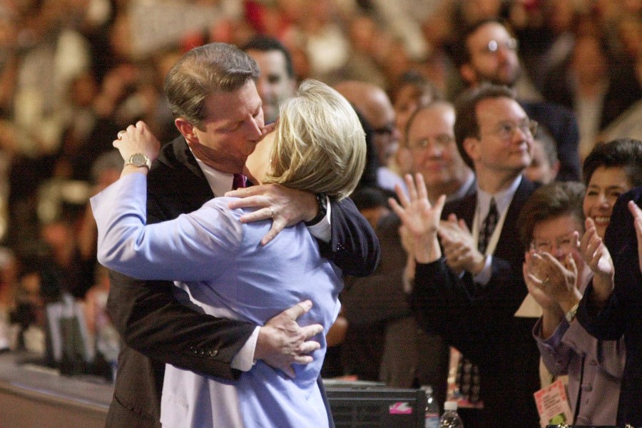 FILE - Democratic presidential nominee Al Gore kisses his wife, Tipper, on the stage at the Democratic National Convention in Los Angeles, Aug. 17, 2000. Presidential conventions can be memorable for floor fights and bloody battles on the streets outside, or for scenes that standout as outlandish or awkward. From Clint Eastwood haranguing of an empty chair in 2012 to Gore's uncomfortably long kiss in 2000 and pitched battles between police and protesters outside in Chicago in 1968, conventions past have produced many memorable moments. (AP Photo/ David J. Phillip, File)