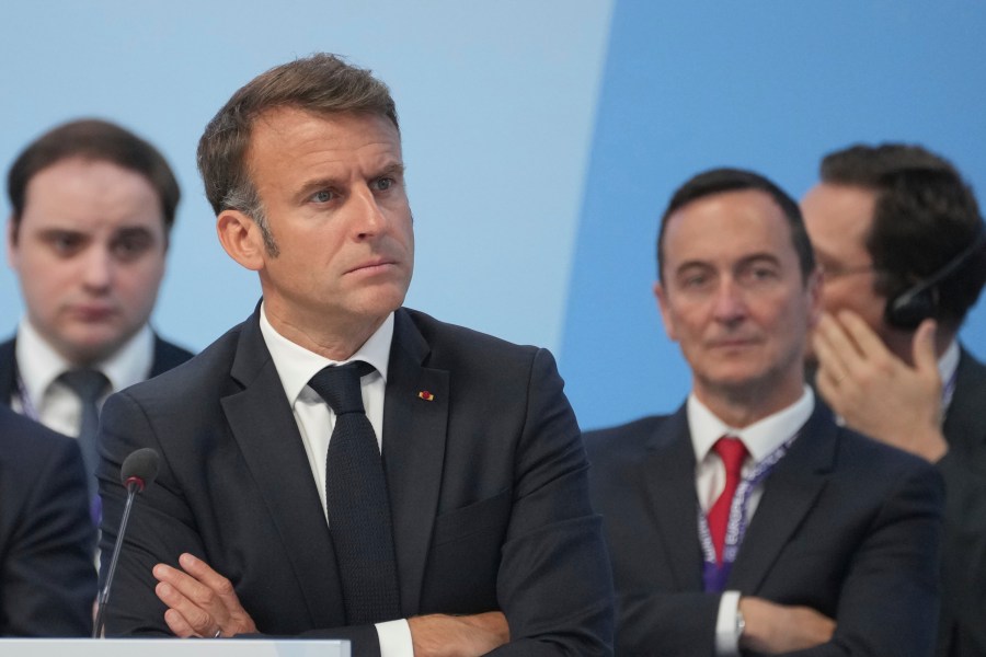 The President of France Emmanuel Macron listens to British Prime Minister Keir Starmer during the first plenary session at the European Political Community meeting in Blenheim Palace, Woodstock, England , Thursday, July 18, 2024. (AP Photo/Kin Cheung, Pool)