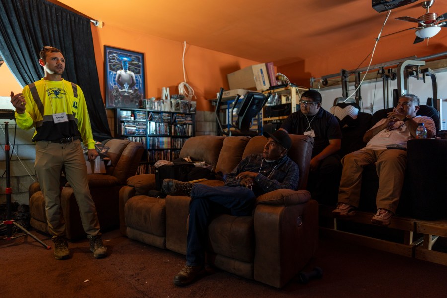 Sitting on recliners in a home movie theater of co-founder Matthew Rantanen's ranch, attendees listen to instructor Dustin LaPointe, left, during the Tribal Broadband Bootcamp in Aguanga, Calif., Wednesday, June 19, 2024. (AP Photo/Jae C. Hong)