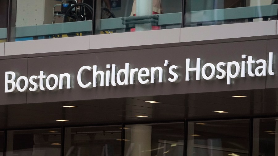 FILE - A sign hangs on the Boston Children's Hospital, Aug. 18, 2022, in Boston. A Massachusetts woman was sentenced Thursday, July 18, 2024, to three years probation for calling in a fake bomb threat at Boston Children’s Hospital in Aug. 2022. (AP Photo/Charles Krupa, File)