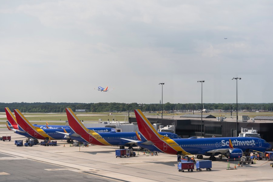 Southwest Airlines planes can be seen on the terminal at Baltimore/Washington International Thurgood Marshall Airport in Baltimore, Friday, July 19, 2024, in Baltimore. (AP Photo/Stephanie Scarbrough)