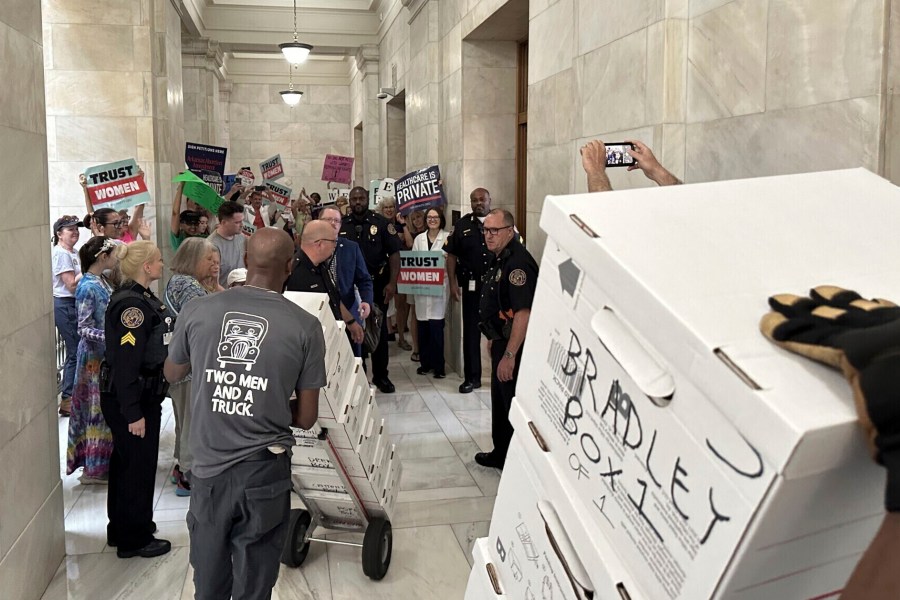 FILE - Boxes containing signatures supporting a proposed ballot measure to scale back Arkansas' abortion ban are delivered to a room in the state Capitol, Friday, July 5, 2024, in Little Rock, Ark. The Arkansas Supreme Court on Tuesday night ordered the state to begin counting signatures submitted in favor of putting an abortion-rights measure on the ballot, but only ones collected by volunteers for the proposal's campaign. (AP Photo/Andrew DeMillo, File)