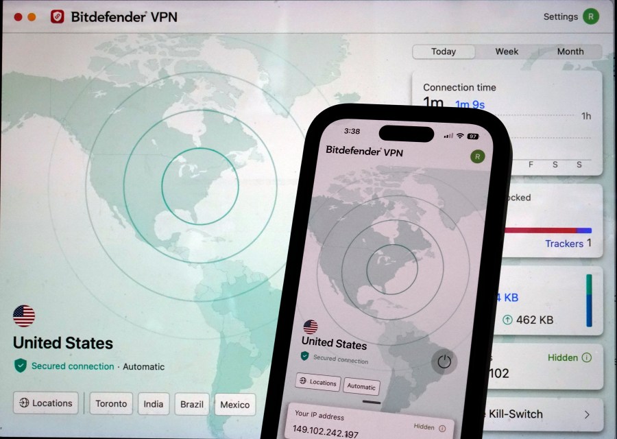 Bitdefender's virtual private network connection page is shown on a computer screen and mobile phone screen, in New York, Monday, July 8, 2024. VPNs should be a part of most people's internet security toolbox, to be switched on in certain cases to hide your location or prevent prying electronic eyes from snooping on what you're doing online. (AP Photo/Richard Drew)