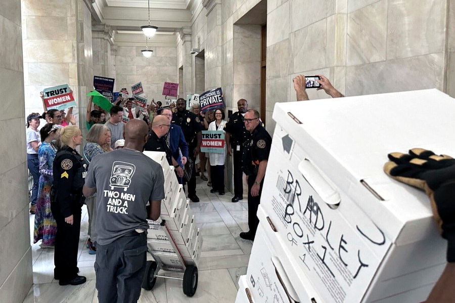 FILE - Boxes containing signatures supporting a proposed ballot measure to scale back Arkansas' abortion ban are delivered to a room in the state Capitol, July 5, 2024, in Little Rock, Ark. The signatures collected by volunteers for an Arkansas abortion-rights measure would fall short of the number needed to qualify for ballot if those are the only ones counted, according to an initial tally from election officials filed with the state Supreme Court on Thursday, July 25. (AP Photo/Andrew DeMillo, File)