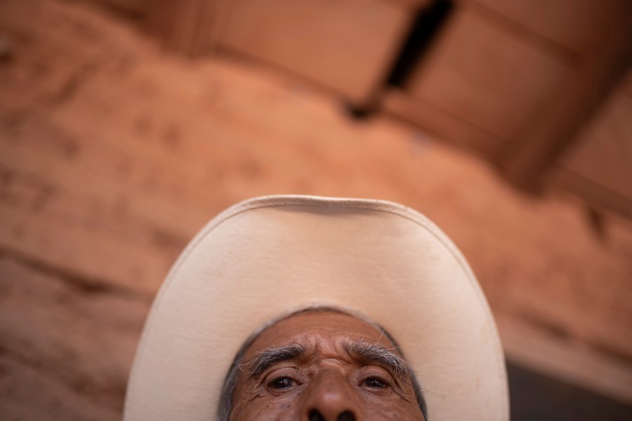 Isaias Ramirez Rojas, 82, shares his story of fleeing cartel violence in the town of Amatenango, Mexico, crossing the border with fellow residents to Ampliación Nueva Reforma, Huehuetenango, Guatemala, Thursday, July 25, 2024. Some refugees are staying at the school and others at locals' homes. (AP Photo/Santiago Billy)