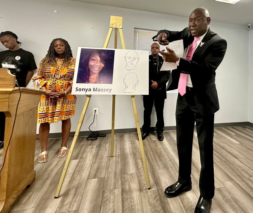 CORRECTS TO PLEADED NOT GUILTY Ben Crump, the civil rights attorney representing the family of Sonya Massey, stands next to a diagram from the slain woman's autopsy on Friday, June 26, 2024, in Springfield, Ill., and gestures to show the downward angle in which Sangamon County Sheriff's Deputy Sean Grayson shot Massey in the face early on July 6. Massey had called 911 with suspicions of a prowler near her Springfield home. Grayson has pleaded not guilty to first-degree murder and other charges. (AP Photo/John O'Connor)