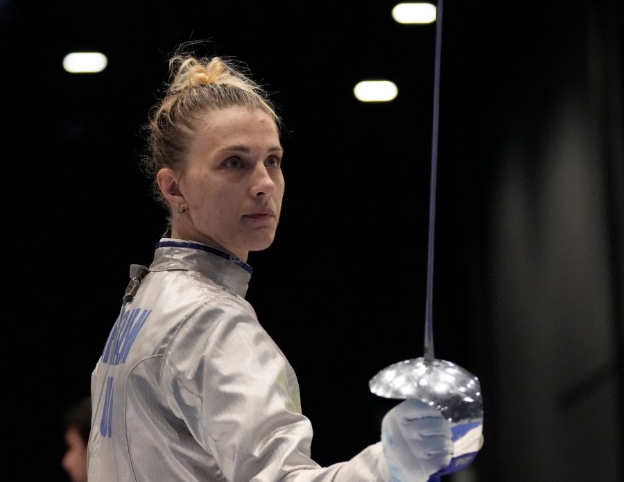 FILE - Olga Kharlan, of Ukraine, stands during the women's team sabre event against Uzbekistan at the Fencing World Championships in Milan, Italy, July 29, 2023. For Ukrainian competitors in Paris for the Olympics, joy goes hand in hand with sorrow. Athletes are striving to enjoy the dream of competing at one of the world’s most prestigious sports events while carrying the burden of the war back home. (AP Photo/Antonio Calanni, File)