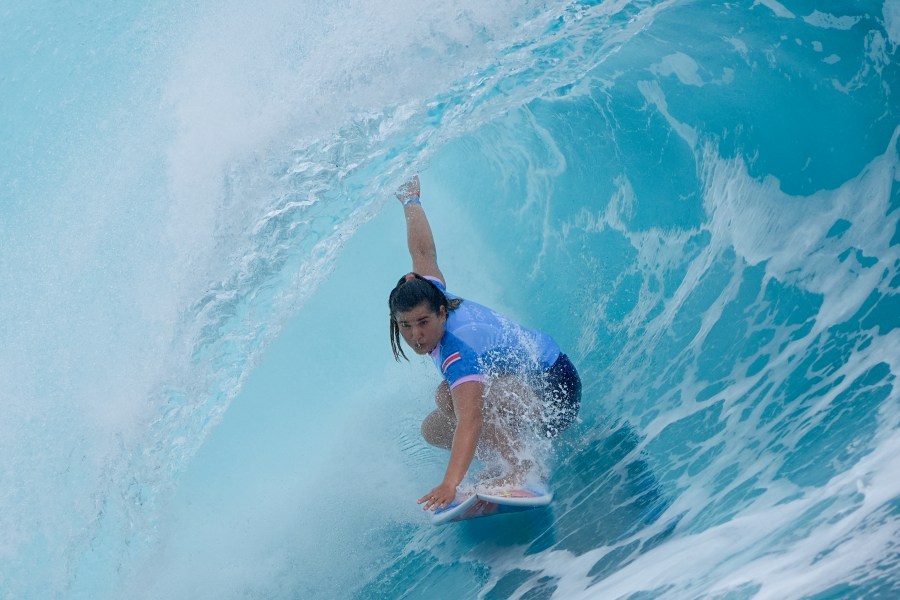 Brisa Hennessy, of Costa Rica, surfs during the first round of the 2024 Summer Olympics surfing competition Saturday, July 27, 2024, in Teahupo'o, Tahiti. (AP Photo/Gregory Bull)