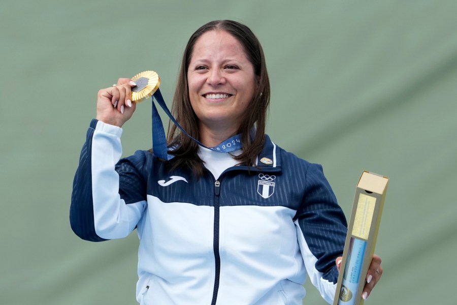 Guatemala's Adriana Oliva Ruano celebrates after winning the gold medal in the Trap women's final at the 2024 Summer Olympics, Wednesday, July 31, 2024, in Chateauroux, France. (AP Photo/Manish Swarup)