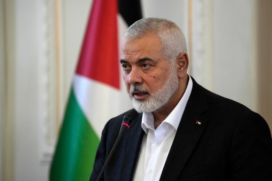 FILE - Hamas chief Ismail Haniyeh speaks during a press briefing after his meeting with Iranian Foreign Minister Hossein Amirabdollahian in Tehran, Iran, March 26, 2024. (AP Photo/Vahid Salemi, File)