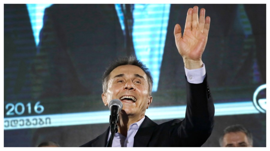 FILE - In this Oct. 8, 2016, file photo, Georgian businessman Bidzina Ivanishvili greets supporters during a rally in Tbilisi, Georgia. (AP Photo/Sergei Grits, file)