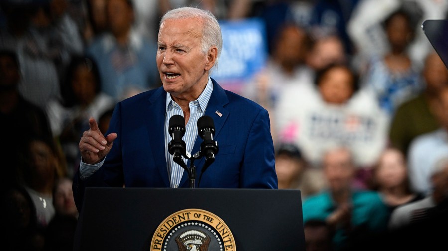 President Biden speaks in front of a crowd.