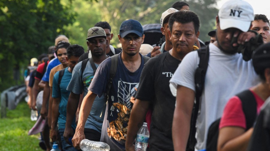 Migrants, mostly from Central America and Venezuela, walk towards the United States on the outskirts of Tuzantan, Chiapas State, Mexico, on July 24, 2024. Hundreds of migrants, mostly from Venezuela and Central America, continued their journey to the United States on foot from a city in southern Mexico, appealing for permits that would allow them to travel freely to the border. (Photo by Isaac Guzman / AFP) (Photo by ISAAC GUZMAN/AFP via Getty Images)