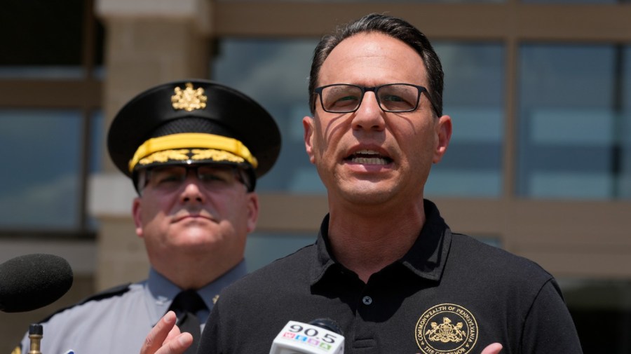 Josh Shapiro, right, governor of Pennsylvania, speaks during a news conference, in Butler, Pa., Sunday, July 14, 2024, concerning the apparent assassination attempt of former President Donald Trump.