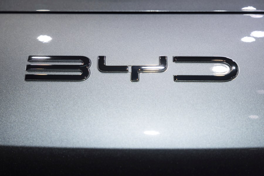 FILE - The BYD logo is pictured during the press day at the 91th Geneva International Motor Show (GIMS) in Geneva, Switzerland, Monday, Feb. 26, 2024. The ride sharing giant Uber and Chinese automaker BYD plan a partnership to introduce 100,000 BYD model EVs on the Uber platform in Europe and Latin America, eventually expanding to other markets, the companies announced. (Cyril Zingaro/Keystone via AP, File)