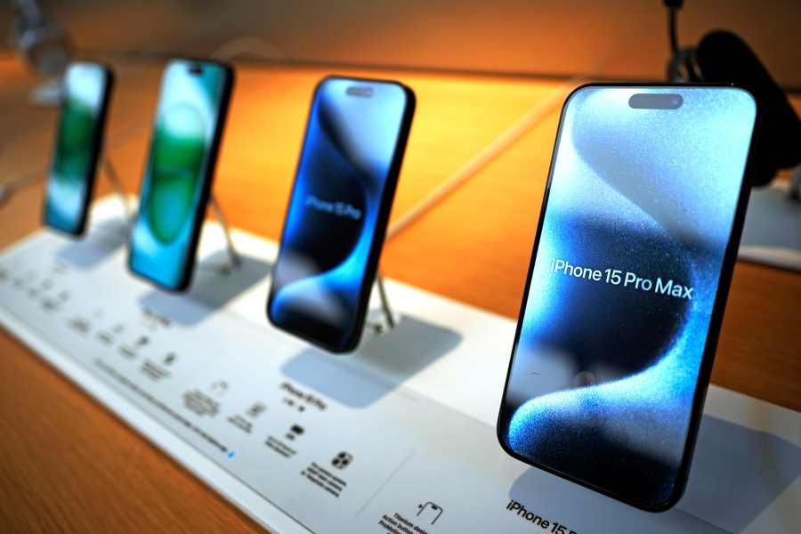 FILE - Apple iPhone 15 ProMax phones are shown in an Apple store in Pittsburgh, on June 3, 2024. Apple reports earnings on Thursday, Aug. 1, 2024. (AP Photo/Gene J. Puskar, File)