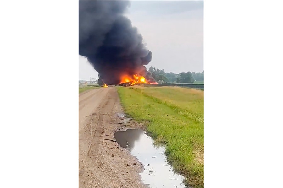 FILE - This photo provided by Doug Zink shows smoke filling the sky after a train derailment, July 5, 2024, near Carrington, N.D. The fiery North Dakota derailment that burned for days early last month was the latest train crash to involve the flawed tank cars that the National Transportation Safety Board has been trying to get off the tracks for decades, according to a preliminary report released Thursday, Aug. 1. (Doug Zink via AP, File)