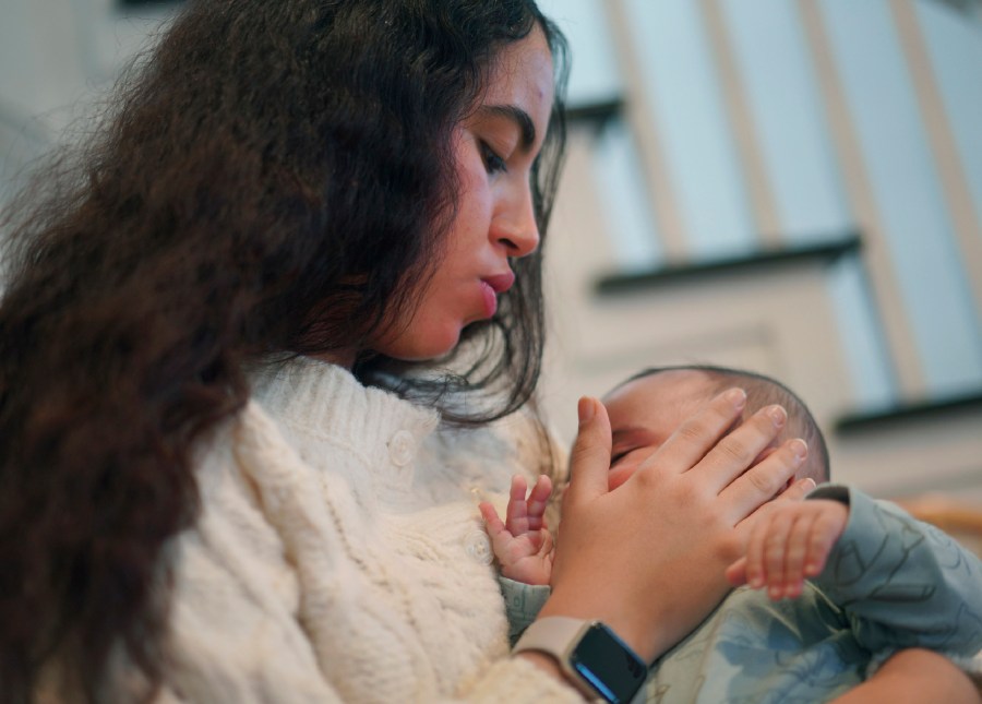 Meryem Bakache, a mother at Mary's Shelter maternity home, comforts her child on Friday, January 5, 2024, in Fredericksburg, Virginia. Today there are more than 450 maternity homes in the U.S., many of them faith-based. Anti-abortion advocates see them as the next step in preventing abortions and providing long-term support for low-income pregnant women and mothers. (AP Photo/Jessie Wardarski)