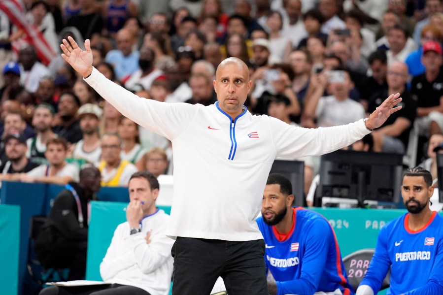 Puerto Rico head coach Nelson Colon gestures during a men's basketball game against the United States at the 2024 Summer Olympics, Saturday, Aug. 3, 2024, in Villeneuve-d'Ascq, France. (AP Photo/Michael Conroy)