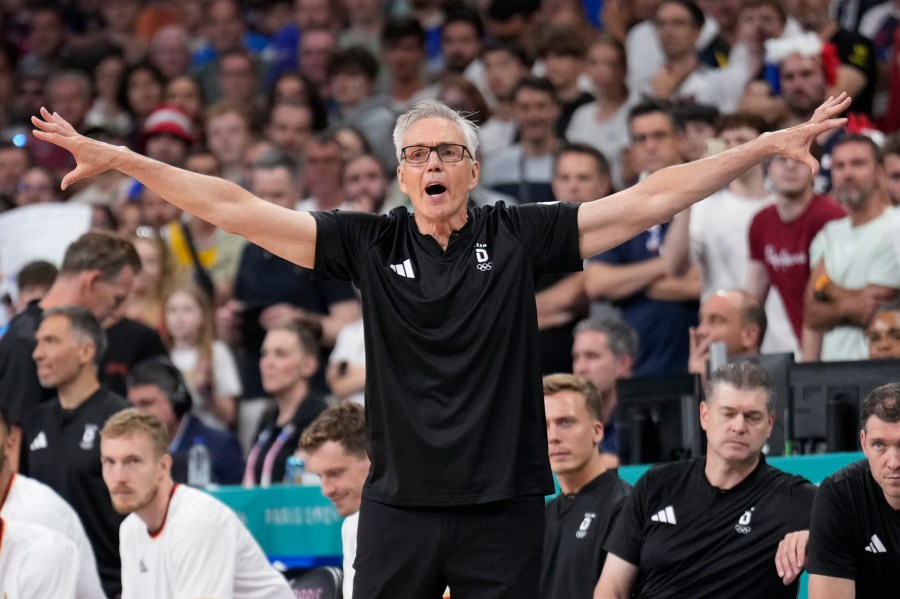 Germany head coach Gordie Herbert gestures in a men's basketball game against France at the 2024 Summer Olympics, Friday, Aug. 2, 2024, in Villeneuve-d'Ascq, France. (AP Photo/Mark J. Terrill)