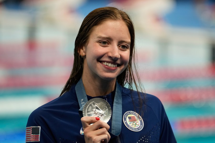 United States' Kate Douglass celebrates with the silver medal during the awards ceremony for the women's 200-meter individual medley at the Summer Olympics in Nanterre, France, Saturday, Aug. 3, 2024. (AP Photo/Brynn Anderson)