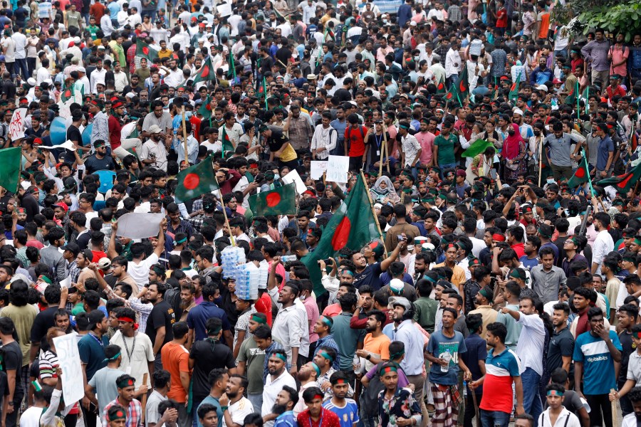 People participate in a rally against Prime Minister Sheikh Hasina and her government demanding justice for the victims killed in the recent countrywide deadly clashes, in Dhaka, Bangladesh, Sunday, Aug. 4, 2024. (AP Photo/Rajib Dhar)