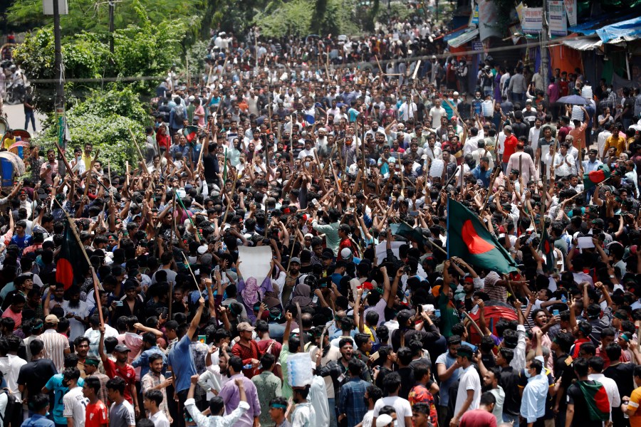 People participate in a rally against Prime Minister Sheikh Hasina and her government demanding justice for the victims killed in the recent countrywide deadly clashes, in Dhaka, Bangladesh, Sunday, Aug. 4, 2024. (AP Photo/Rajib Dhar)