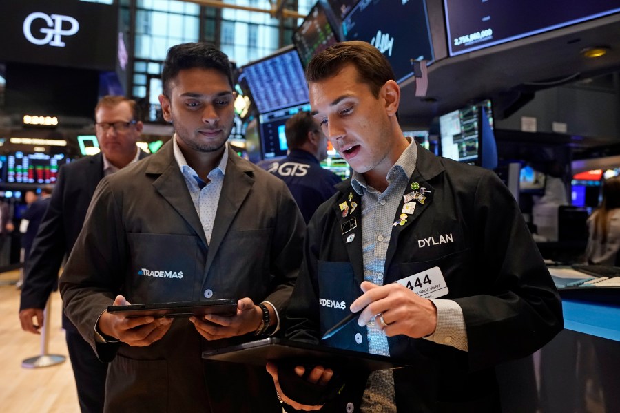 A pair of traders work on the floor of the New York Stock Exchange, Tuesday, Aug. 6, 2024.(AP Photo/Richard Drew)