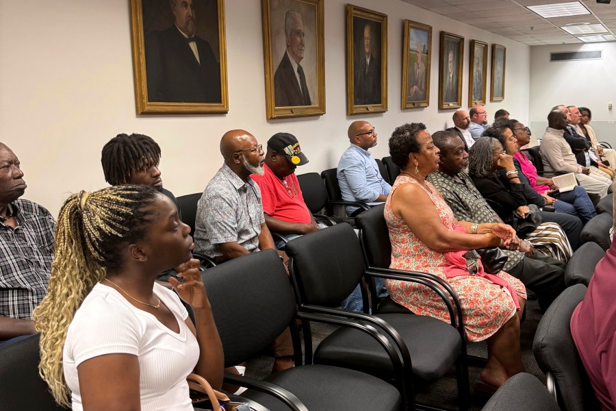 Sparta residents attend a Georgia Public Service Commission hearing on whether a railroad company can use eminent domain to condemn property in their community, Tuesday, Aug. 6, 2024, in Atlanta. (AP Photo/Charlotte Kramon)