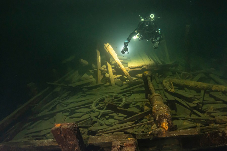 A diver from the Polish Baltictech team inspects wreckage of a 19th century sailing ship that the team discovered July 11, 2024, on the Baltic seabed about 37 kilometers (20 nautical miles) south of the Swedish isle of Öland. (Marek Cacaj/Baltictech via AP)