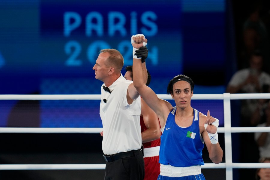 Algeria's Imane Khelif gestures after defeating Thailand's Janjaem Suwannapheng in their women's 66 kg semifinal boxing match at the 2024 Summer Olympics, Tuesday, Aug. 6, 2024, in Paris, France. (AP Photo/Ariana Cubillos)