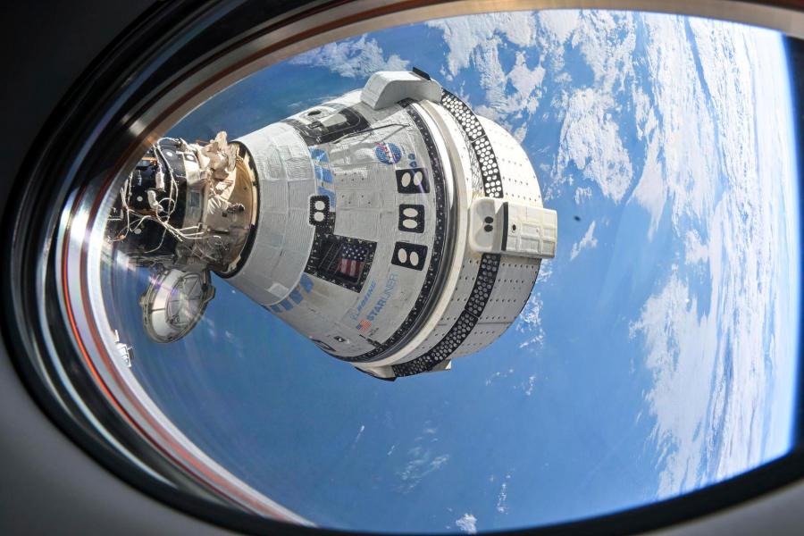 This photo provided by NASA shows Boeing's Starliner spacecraft which launched astronauts Butch Wilmore and Suni Williams to the International Space Station docked to the Harmony module's forward port on July 3, 2024, seen from a window on the SpaceX Dragon Endeavour spacecraft docked to the adjacent port. (NASA via AP)