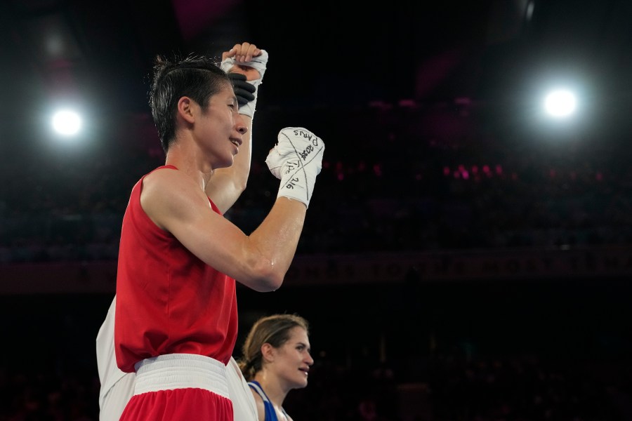 Taiwan's Lin Yu-ting celebrates after defeating Turkey's Esra Yildiz in their women's 57 kg semifinal boxing match at the 2024 Summer Olympics, Wednesday, Aug. 7, 2024, in Paris, France. (AP Photo/Ariana Cubillos)