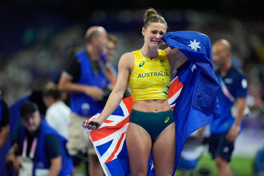 Nina Kennedy, of Australia, reacts after winning the women's pole vault final at the 2024 Summer Olympics, Wednesday, Aug. 7, 2024, in Saint-Denis, France. (AP Photo/Rebecca Blackwell)