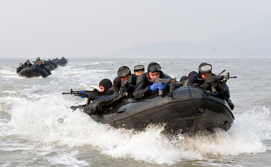 FILE - South Korean and United States marines ride on inflatable boats during a joint landing exercise to prepare for a possible North Korea's surprise attack in waters off Ganghwa Island, located inside of the civilian passage restriction line that separates the two Koreas since the Korean War, South Korea, Feb. 10, 2015. (Yonhap via AP, File)