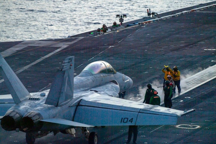 In this photograph released by the U.S. Navy, an F/A-18 Super Hornet prepares to launch off the flight deck of the Nimitz-class aircraft carrier USS Theodore Roosevelt July 5, 2024, in the South China Sea. (Seaman Aaron Haro Gonzalez/U.S. Navy via AP)