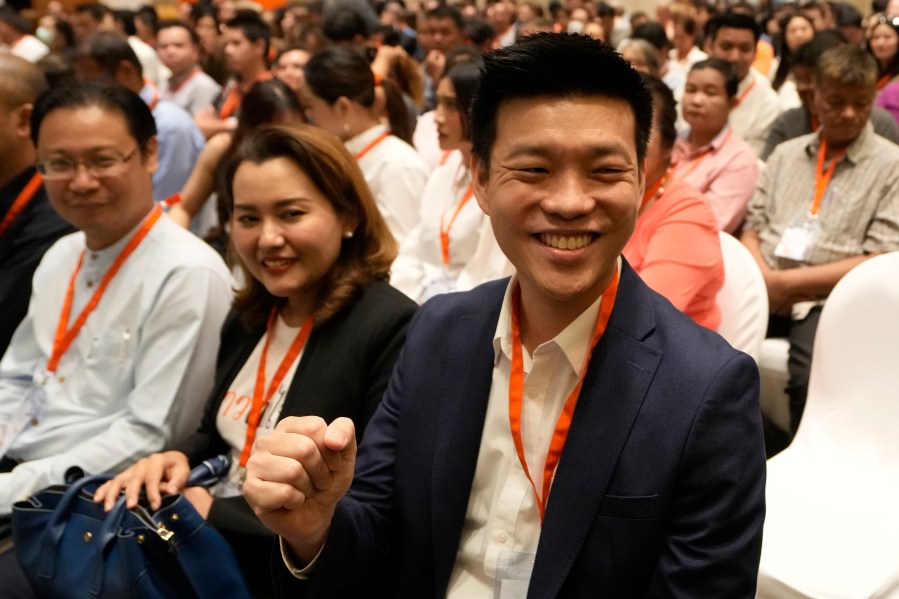 Natthaphong Ruengpanyawut, front right, a member of the disbanded Move Forward Party prepares to attend a meeting in Bangkok, Thailand, Friday, Aug. 9, 2024. (AP Photo/Sakchai Lalit)