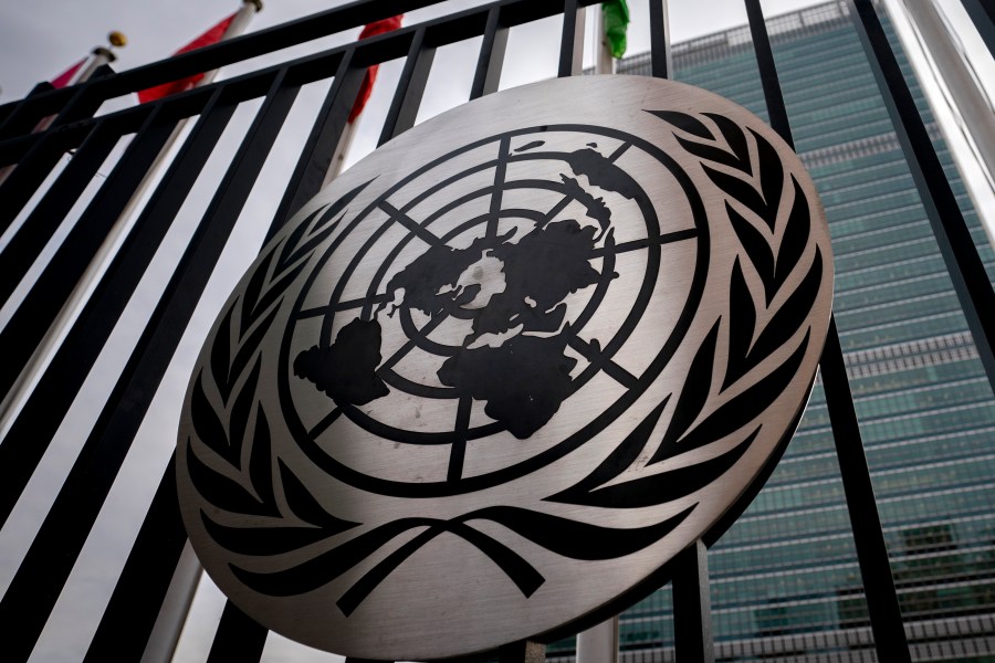 FILE - The symbol of the United Nations is displayed on the main gate outside UN headquarters, Feb. 24, 2022, in New York. (AP Photo/John Minchillo, File)