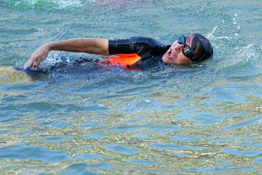 FILE - Paris Mayor Anne Hidalgo swims in the Seine river Wednesday, July 17, 2024 in Paris, France. (AP Photo/Michel Euler, File)