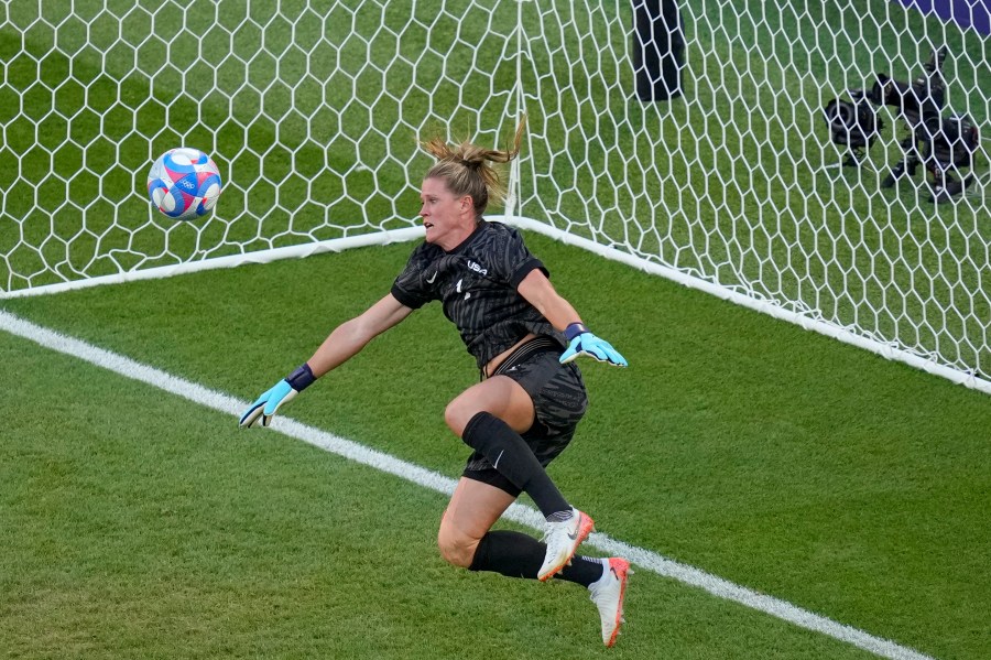 Goalkeeper Alyssa Naeher, of the United States saves a header by Brazil's Adriana during the women's soccer gold medal match between Brazil and the United States at the Parc des Princes during the 2024 Summer Olympics, Saturday, Aug. 10, 2024, in Paris, France. (AP Photo/Vadim Ghirda)