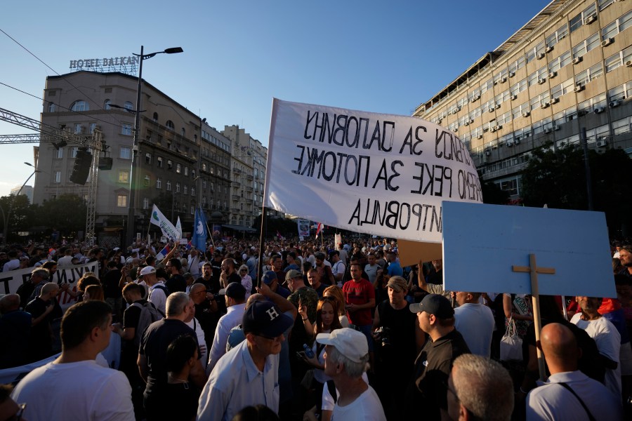 People attend a protest against pollution and the exploitation of a lithium mine in the country, in Belgrade, Serbia, Saturday, Aug. 10, 2024. Thousands were gathering Saturday at a rally against lithium mining in Serbia despite government warnings of alleged planned unrest designed to topple the government of populist President Aleksandar Vucic. (AP Photo/Darko Vojinovic)