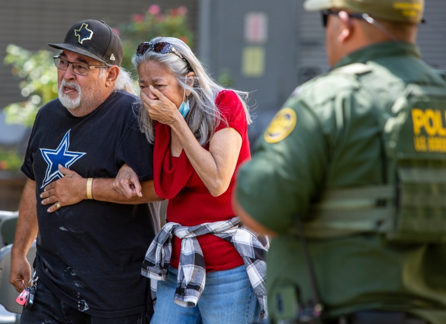 FILE - A woman cries as she leaves the Uvalde Civic Center after shooting a was reported earlier in the day at Robb Elementary School, Tuesday, May 24, 2022, in Uvalde, Texas. (William Luther/The San Antonio Express-News via AP)