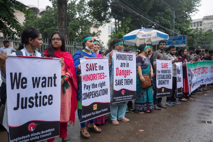 Bangladesh Hindus hold a protest rally condemning communal atrocities committed against them and other religious groups in the Muslim-majority country, in Dhaka, Bangladesh, Sunday, Aug. 11, 2024. (AP Photo/Rajib Dhar)